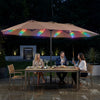 Extra-large 15.5FT brown patio umbrella with 144 LED lights, ideal for enhancing outdoor dining experiences.
