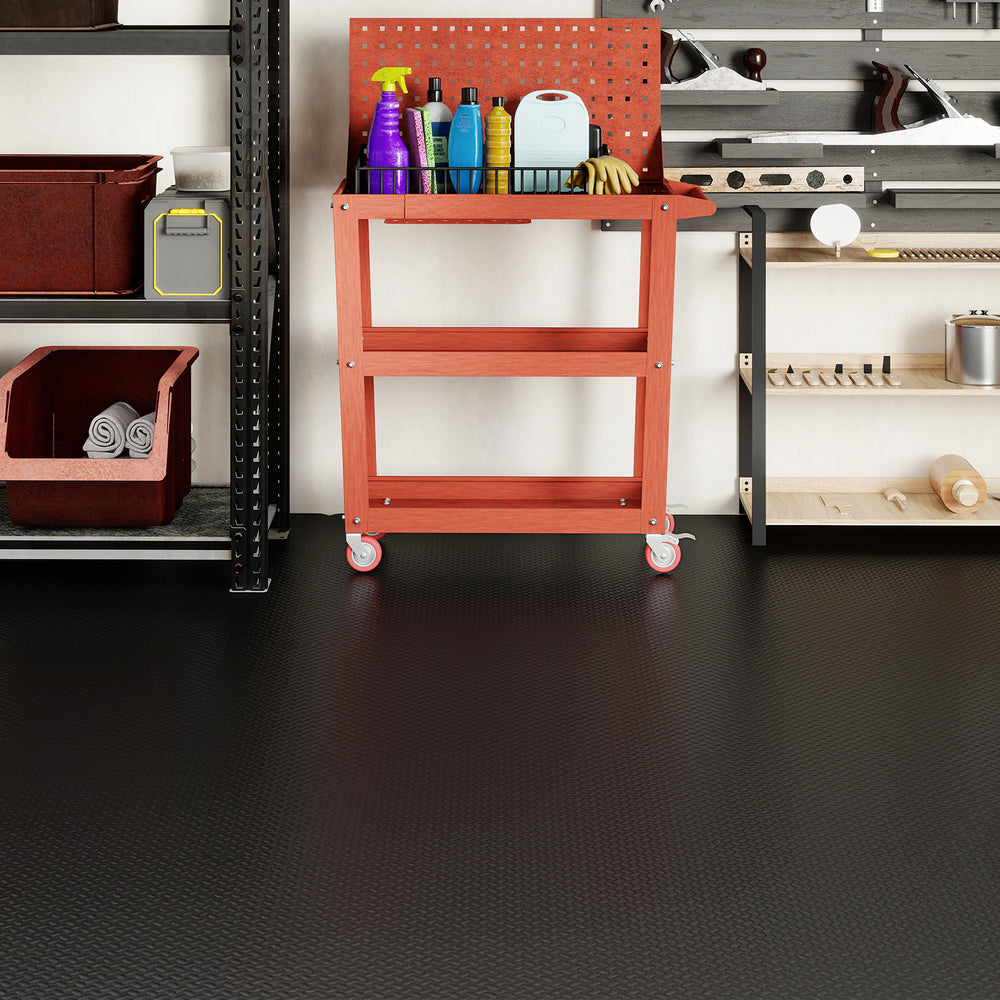 Red tool cart with cleaning supplies in a garage setting, featuring waterproof PE mechanic pads for durable flooring.