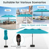 Turquoise 15ft double-sided patio umbrella with easy crank mechanism, perfect for providing shade in various outdoor.