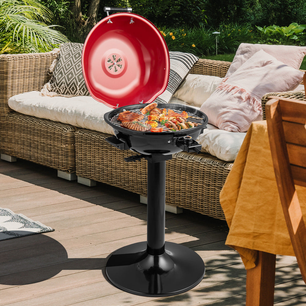 Electric BBQ grill with removable non-stick warming rack in red, ideal for outdoor cooking and family gatherings.