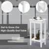 White 2-tier end table with solid wood legs and storage shelf, perfect for bedside or sofa side placement.