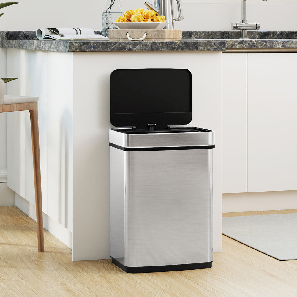 16-gallon stainless steel trash can with infrared motion sensor, dual compartments, and soft closing lid for easy waste.