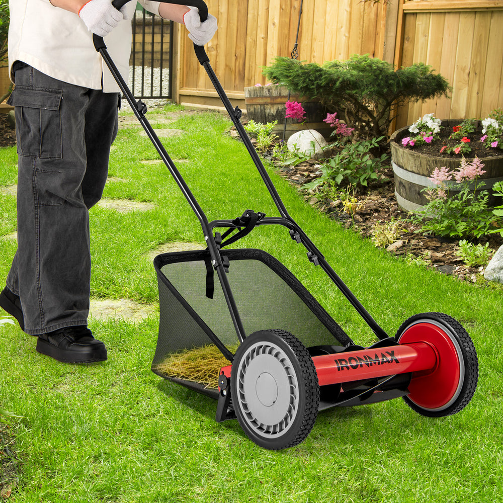 16-inch push lawn mower in action, showcasing manual operation and 5 steel blades for precise grass cutting efficiency.