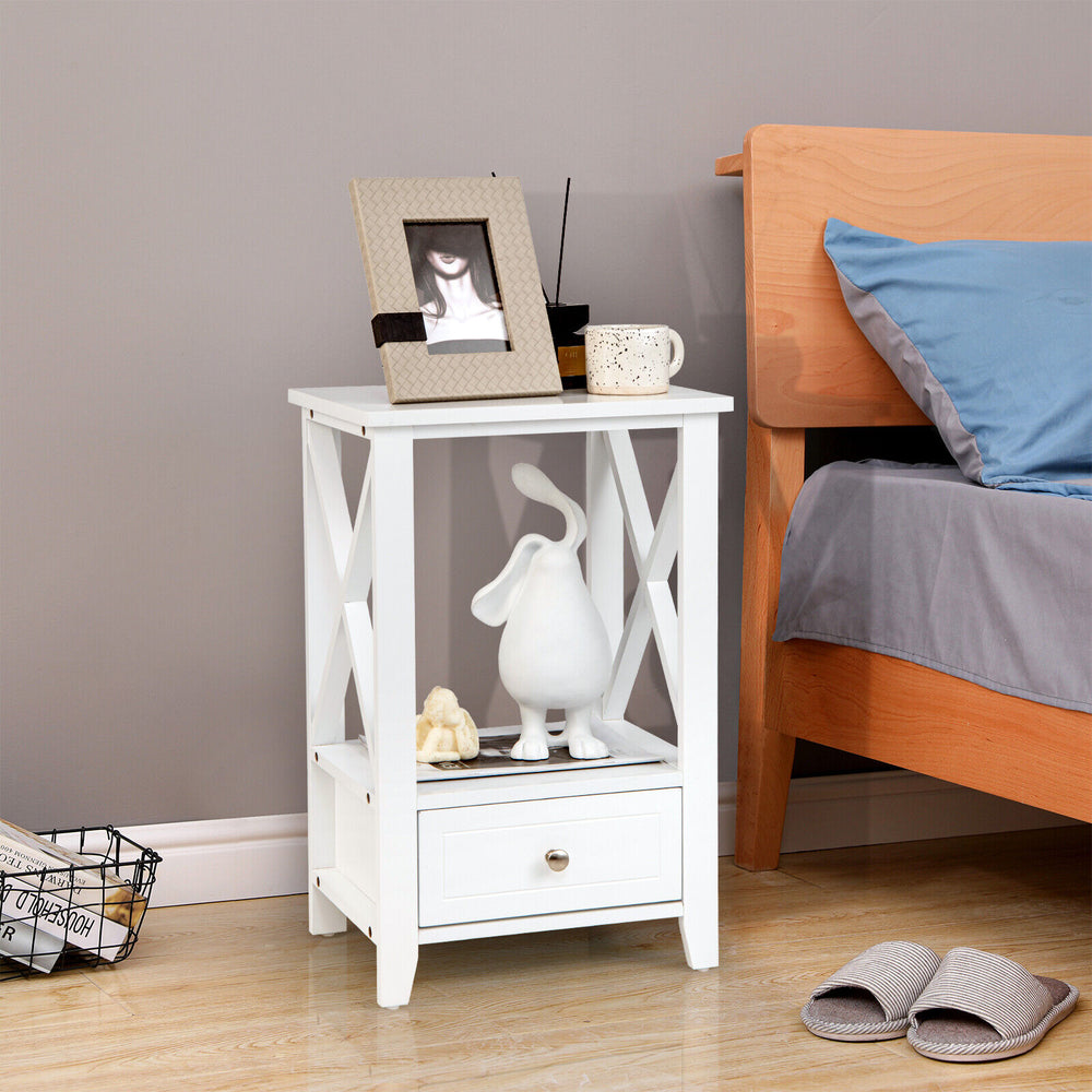 White nightstand with X-shaped design, featuring a spacious open shelf and large drawer for clutter-free organization.