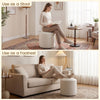 Round beige storage ottoman with a reversible lid, serving as a stool or footrest for versatile living space use.