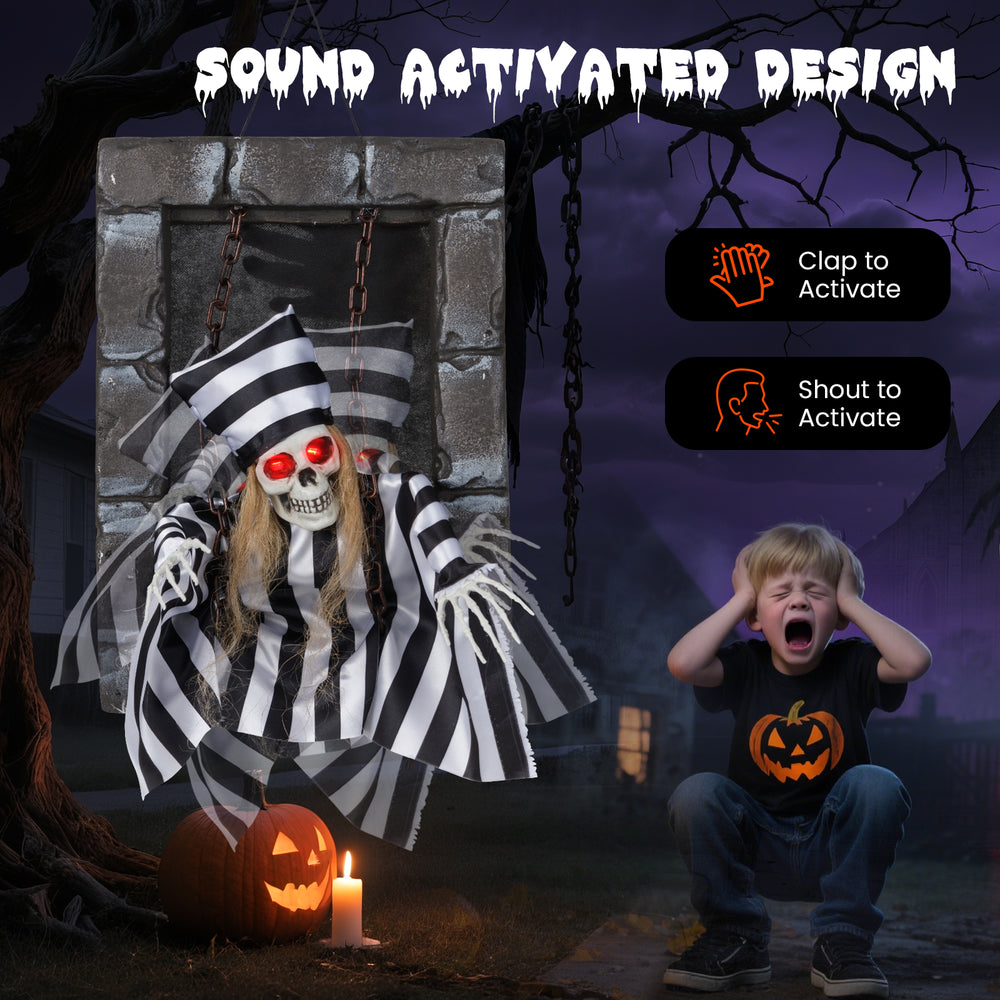 Hanging 18-inch animated skull prisoner decoration with sound activation, LED eyes, and creepy movements for Halloween.