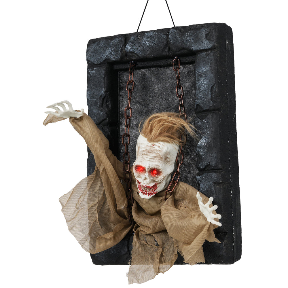 Hanging animated zombie prisoner decoration with glowing red eyes and sound activation for a spooky Halloween.