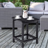 Black 18-inch weather-resistant side table made of HDPE, perfect for outdoor use with Adirondack chairs on patio.