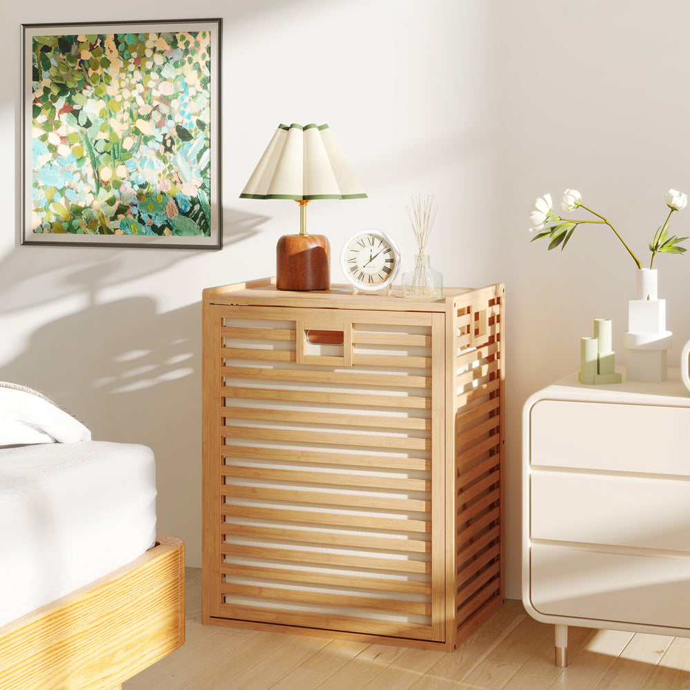 Natural bamboo tilt-out laundry hamper with removable fabric bin, perfect for bathrooms and laundry areas.