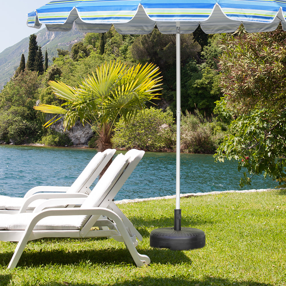 Heavy-duty 18-inch round umbrella base stand filled with sand, designed for stability in outdoor settings like patios.