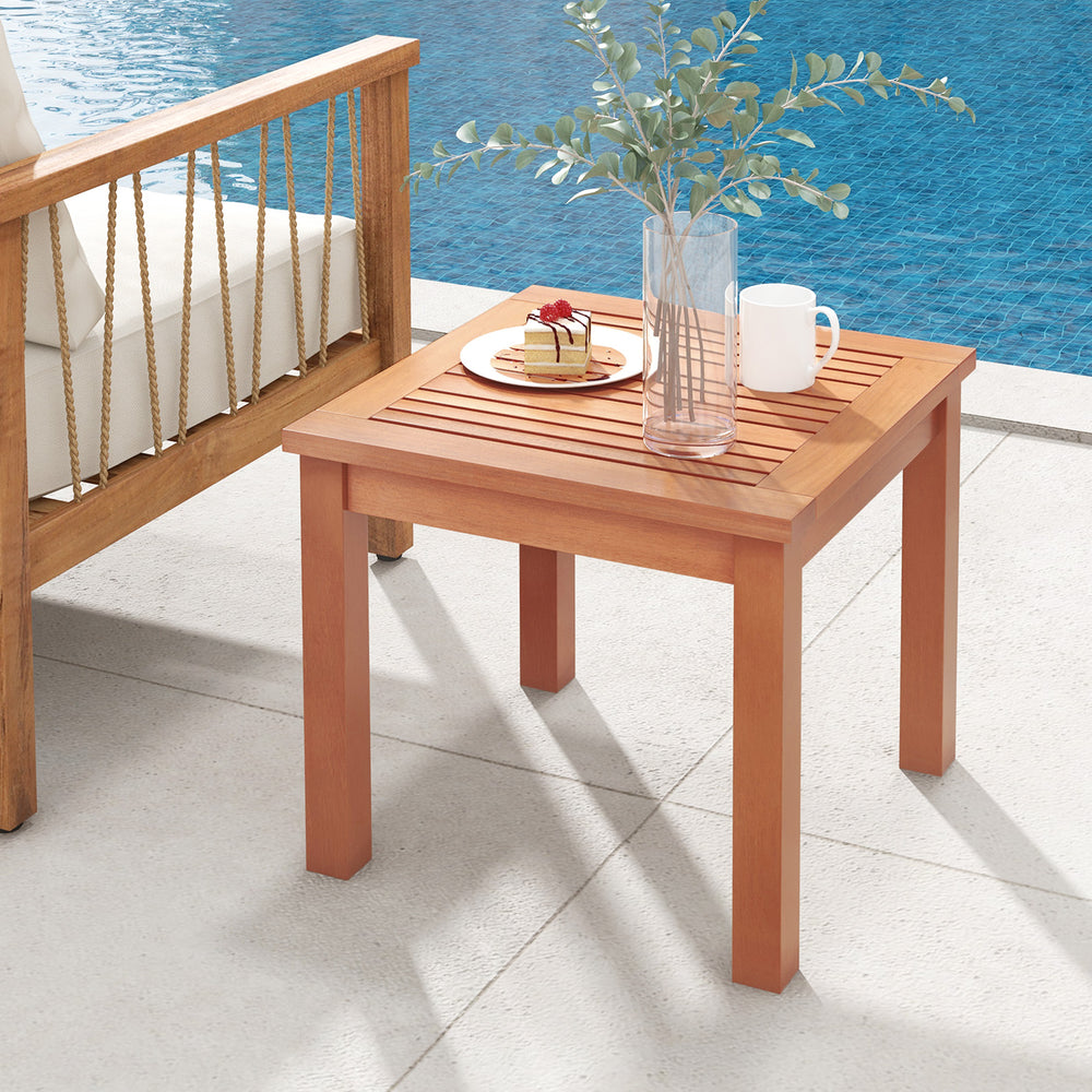 Square end outdoor side table made of eucalyptus wood with a slatted tabletop, perfect for patio or poolside use.