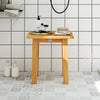 Teak shower bench with solid construction and water-resistant finish, perfect for shaving legs or as a side table.