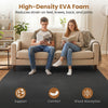 Interlocking black EVA foam floor tiles provide comfort and shock absorption, ideal for home gyms and living rooms.