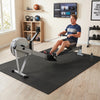 Interlocking EVA foam floor tiles in black provide shock absorption and a non-slip surface for home gym comfort.