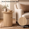 Round fluted side table with pedestal design, crafted from engineered wood, perfect for small spaces in any room.