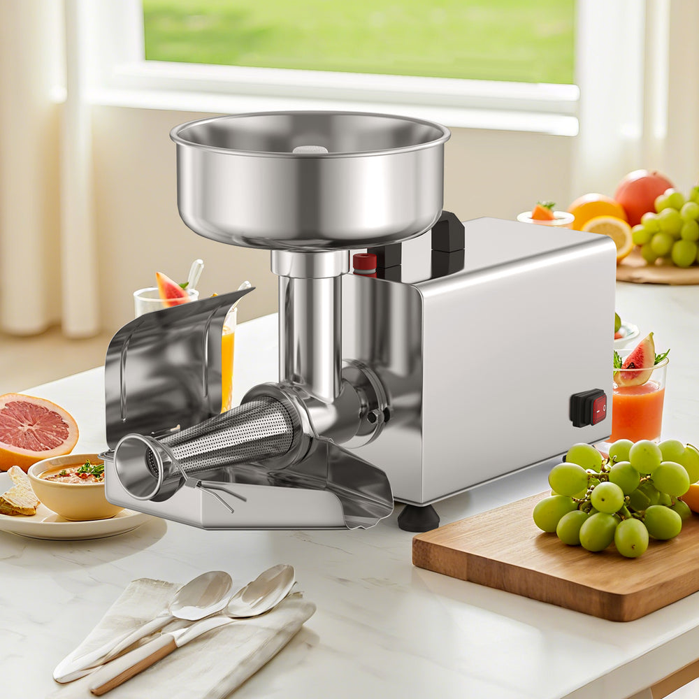 Stainless steel 450W electric tomato strainer with large feed chute, ideal for making jams on kitchen countertop.