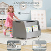 Wooden mobile toy storage organizer in gray with lockable wheels, featuring a front bookshelf for easy access to books.
