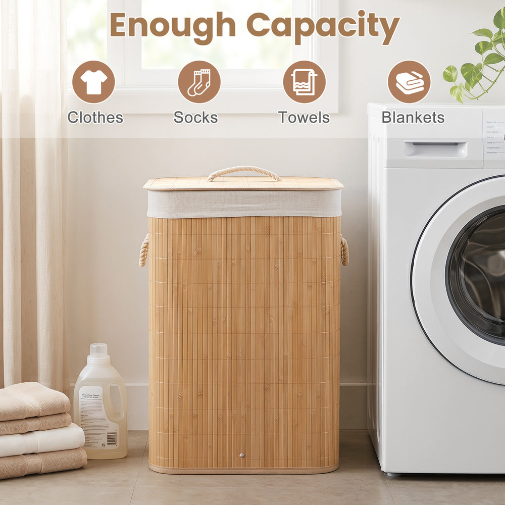 Bamboo clothes hamper with removable liner, 19-gal capacity, and portable handles for easy laundry storage.