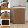Bamboo clothes hamper with removable liner, solid metal frame, and side handles for easy carrying in brown.