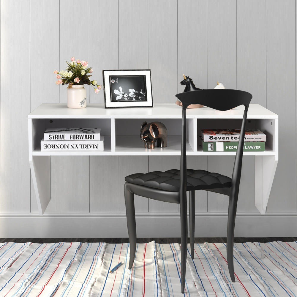 Wall-mounted floating computer desk in white with three storage compartments, ideal for home or office use.