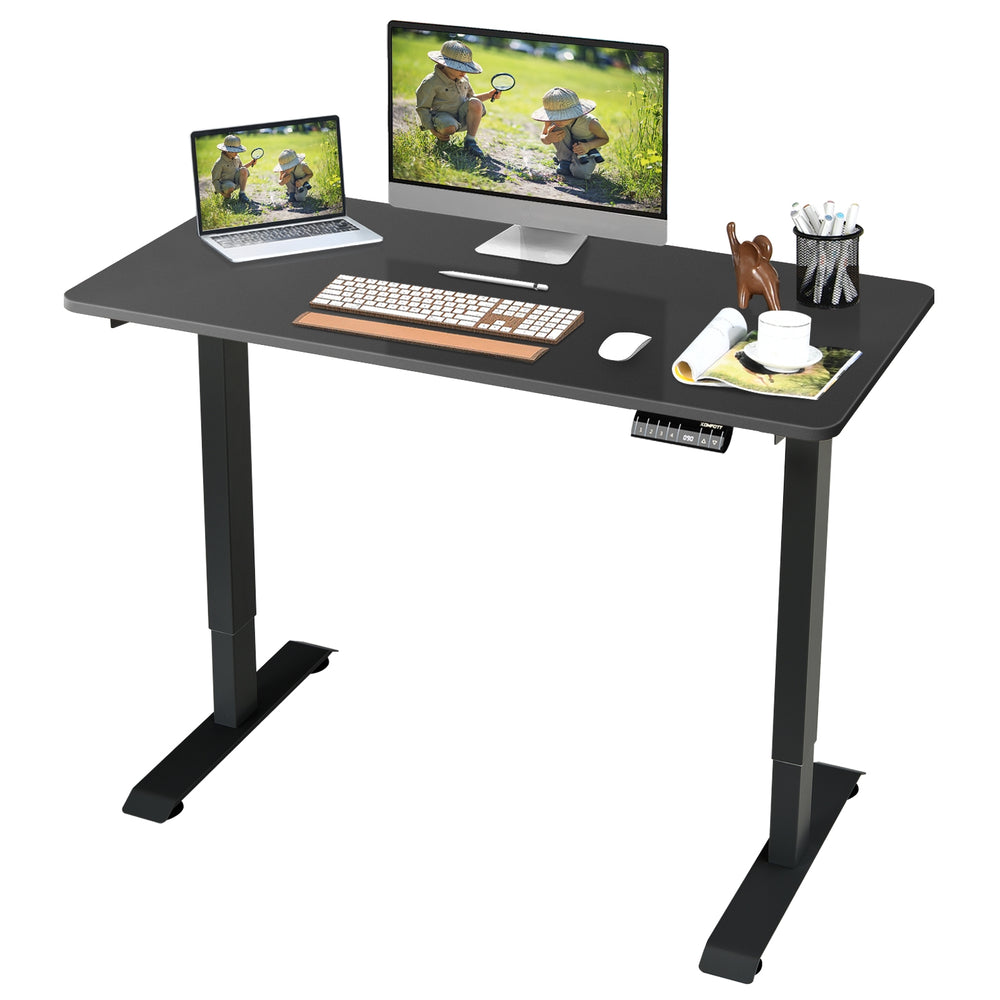 Electric height adjustable standing desk in black with memory controller, providing a spacious workspace for comfort.