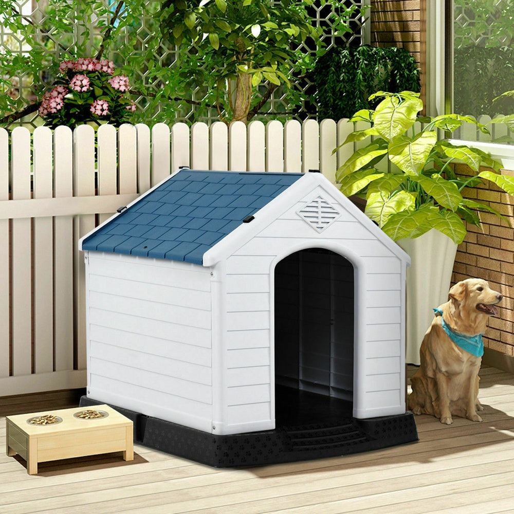 Durable plastic waterproof dog house with a blue roof, providing a safe outdoor shelter for pets. Easy to clean and.