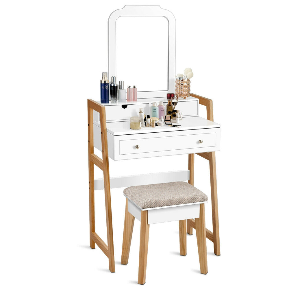 Vanity table set with cushioned stool, large mirror, and three drawers for organized cosmetic storage and elegant decor.
