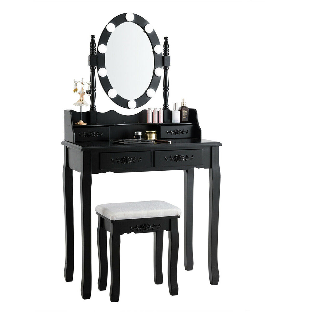 Black makeup dressing table with lighted mirror, cushioned stool, and four drawers for ample storage and elegant design.