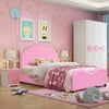 Twin size upholstered toddler bed in pink with rounded edges and wood slat support for safe, comfortable sleeping.
