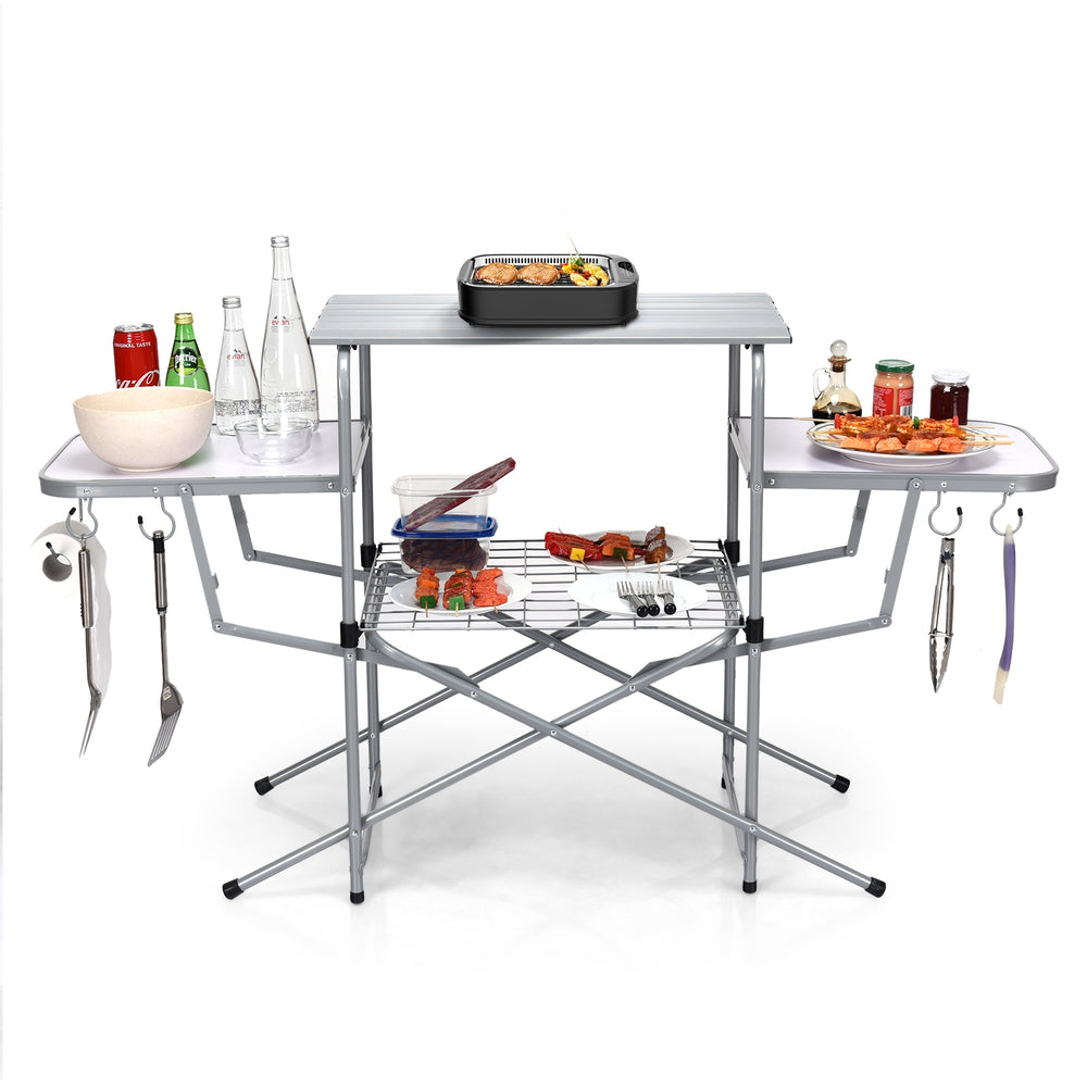 Foldable outdoor BBQ table with heat-resistant aluminum top, side shelves, and hooks for easy grilling and storage.
