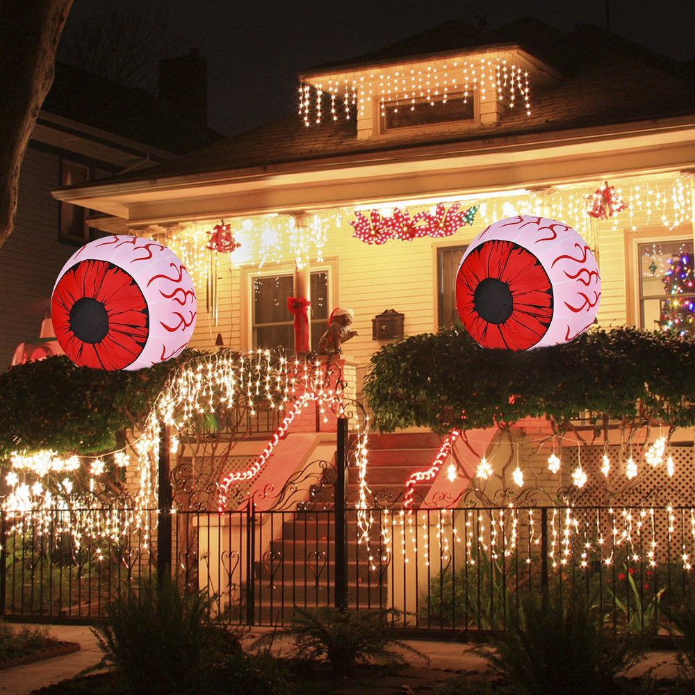 Two 3-foot Halloween inflatable eyeballs with bloodshot patterns and red LED lights, perfect for spooky outdoor decor.