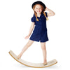 Child balancing on a 12-inch natural birch wobble board, promoting coordination and imaginative play indoors or.