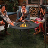 Round 35.5-inch patio fire pit dining table with cooking BBQ grate, featuring a sturdy steel frame for outdoor.