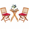 Folding bistro set featuring two acacia wood chairs with red cushions and a round coffee table, perfect for outdoor use.