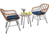 Two navy cushioned rattan armchairs and a glass-top side table on a patio by the pool, perfect for outdoor relaxation.