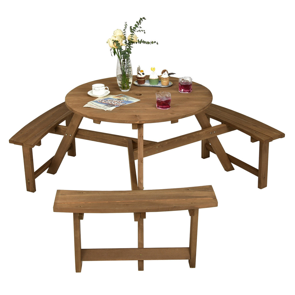 Round wooden picnic table with umbrella hole and three built-in benches, perfect for outdoor patio gatherings.