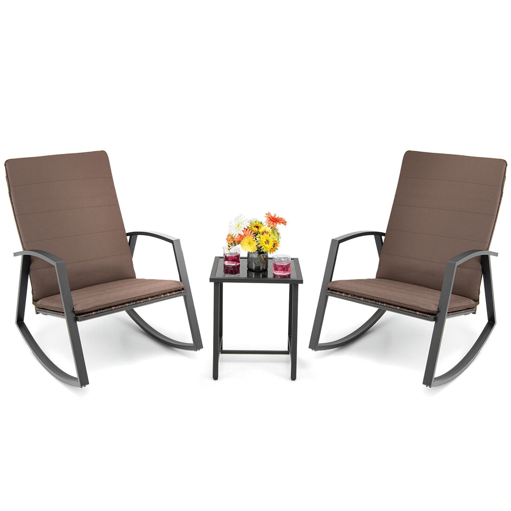 Brown 3-piece patio rattan rocking furniture set with cushions and side table, perfect for outdoor relaxation.