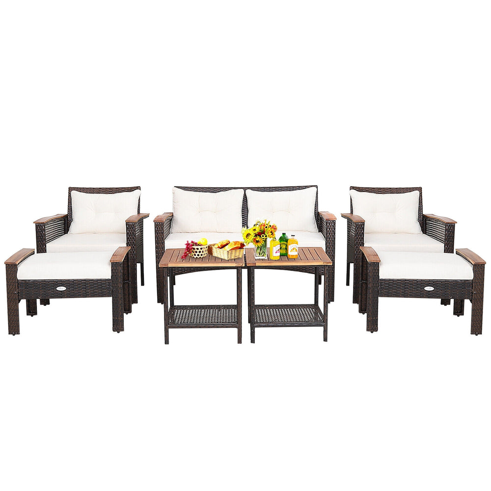 7-piece patio rattan conversation set featuring cushioned loveseat, chairs, and tables, perfect for outdoor gatherings.