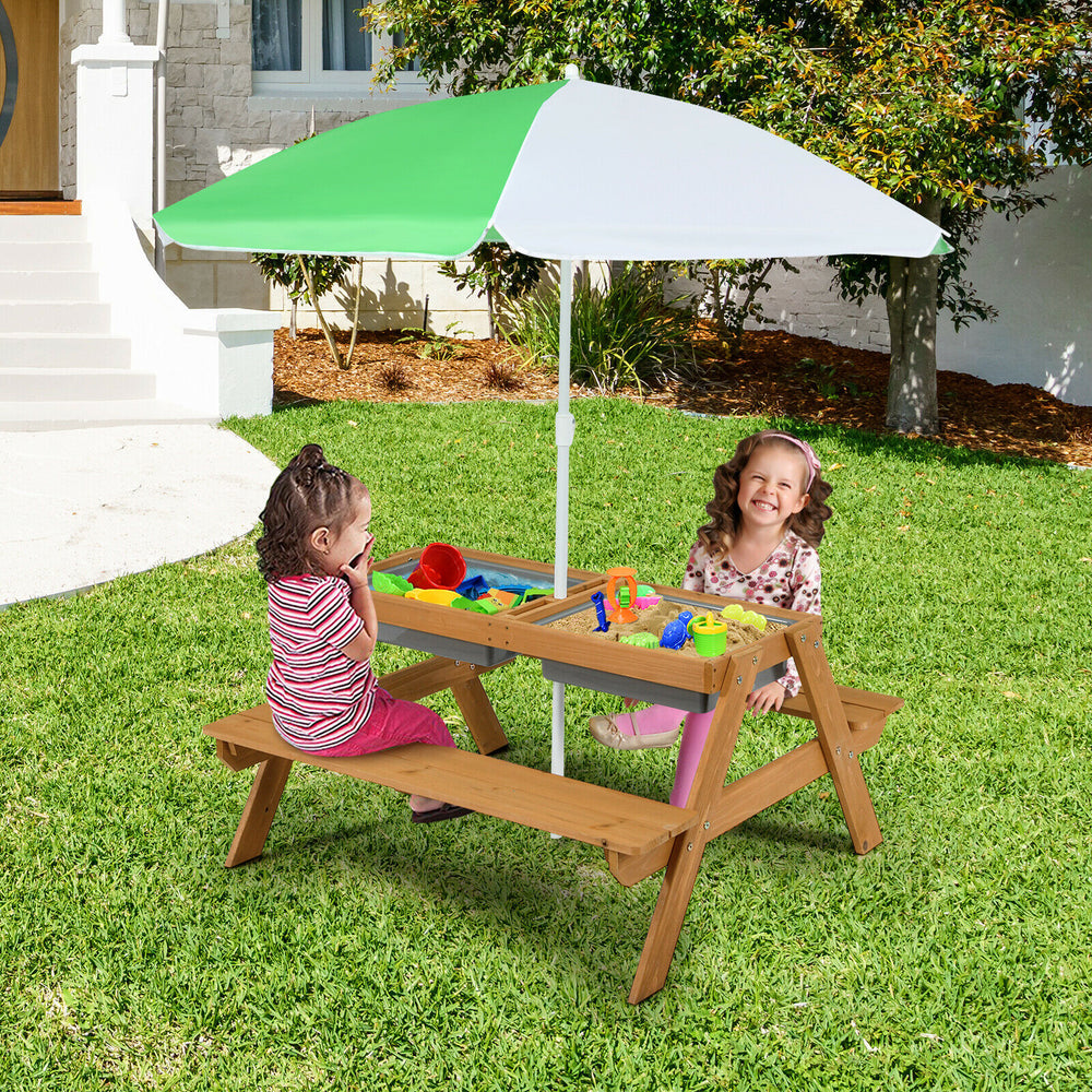 Kids enjoying the 3-in-1 outdoor picnic water sand table with umbrella, perfect for playtime in the yard.