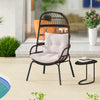 Patio wicker egg chair in brown with soft cushions, designed for outdoor relaxation by the poolside or in the backyard.