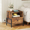 Rustic brown nightstand with charging station, drawer, and open compartment for versatile storage beside a sofa.