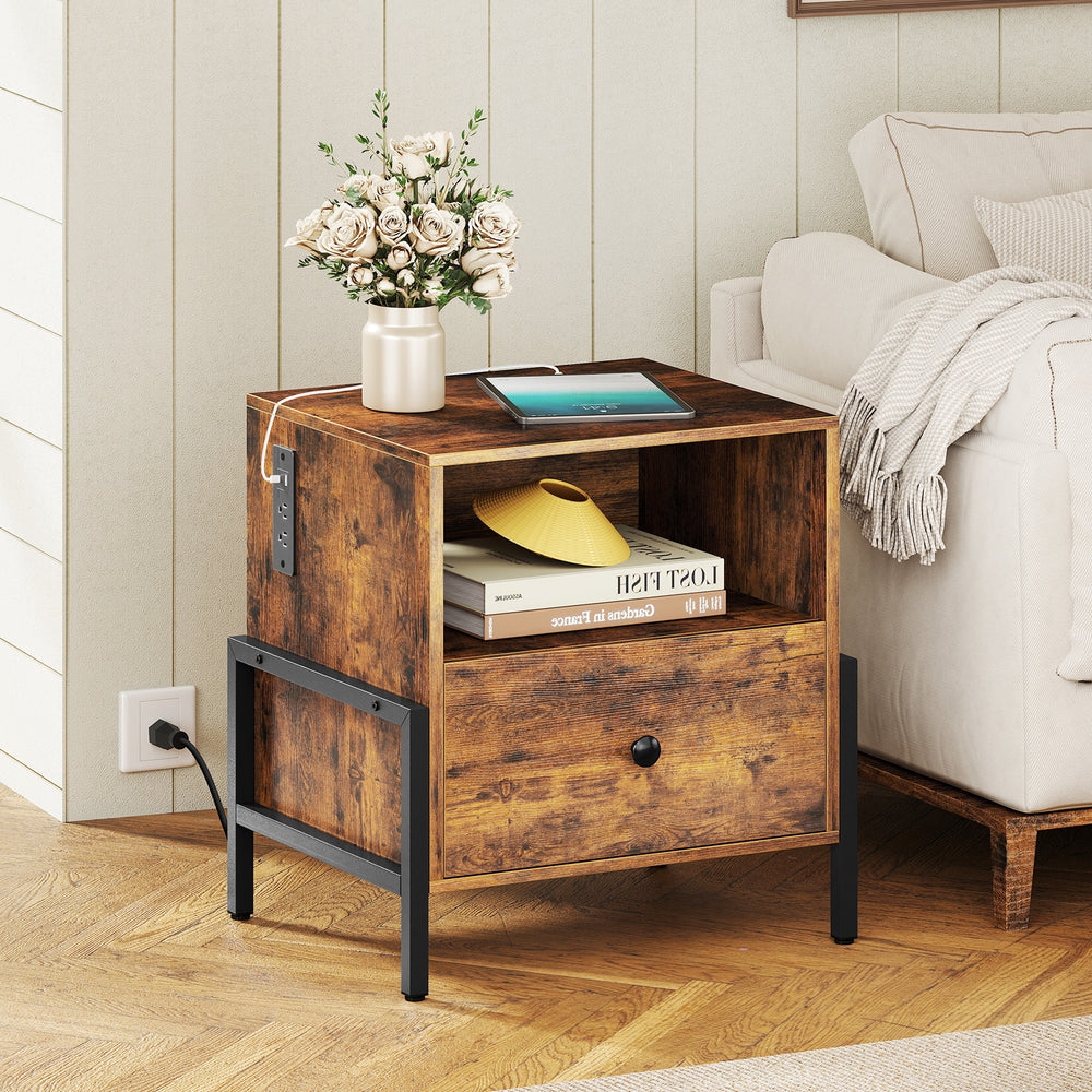 Rustic brown nightstand with charging station, drawer, and open compartment for versatile storage beside a sofa.
