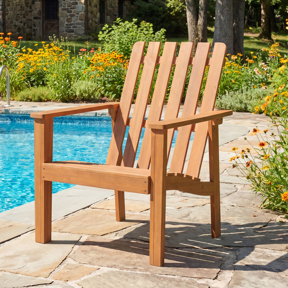 Acacia wood outdoor patio chair with slatted backrest and armrests, perfect for relaxing by the pool.