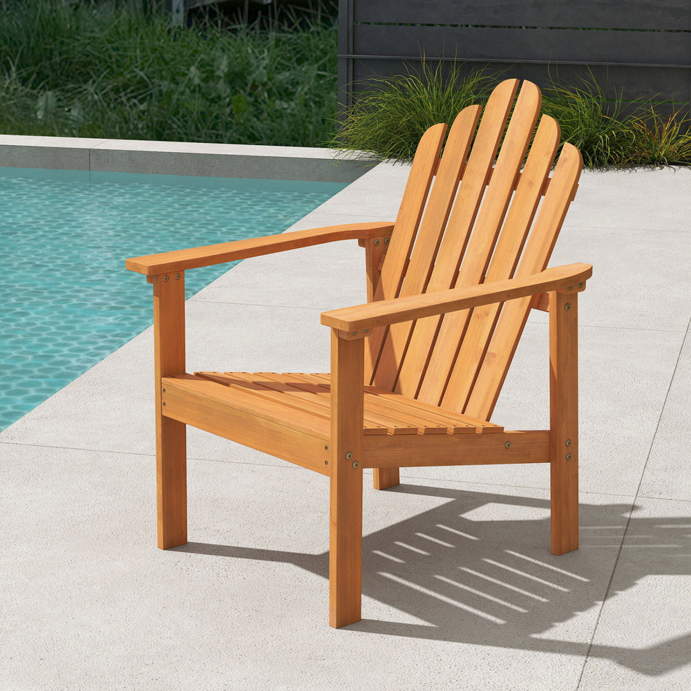 Stackable Adirondack chair made of solid acacia wood, perfect for patio relaxation by the poolside.