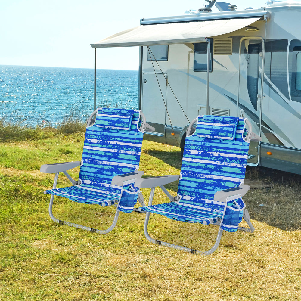 Two foldable backpack beach chairs in navy with adjustable backrests, cup holders, and storage pockets, perfect for.