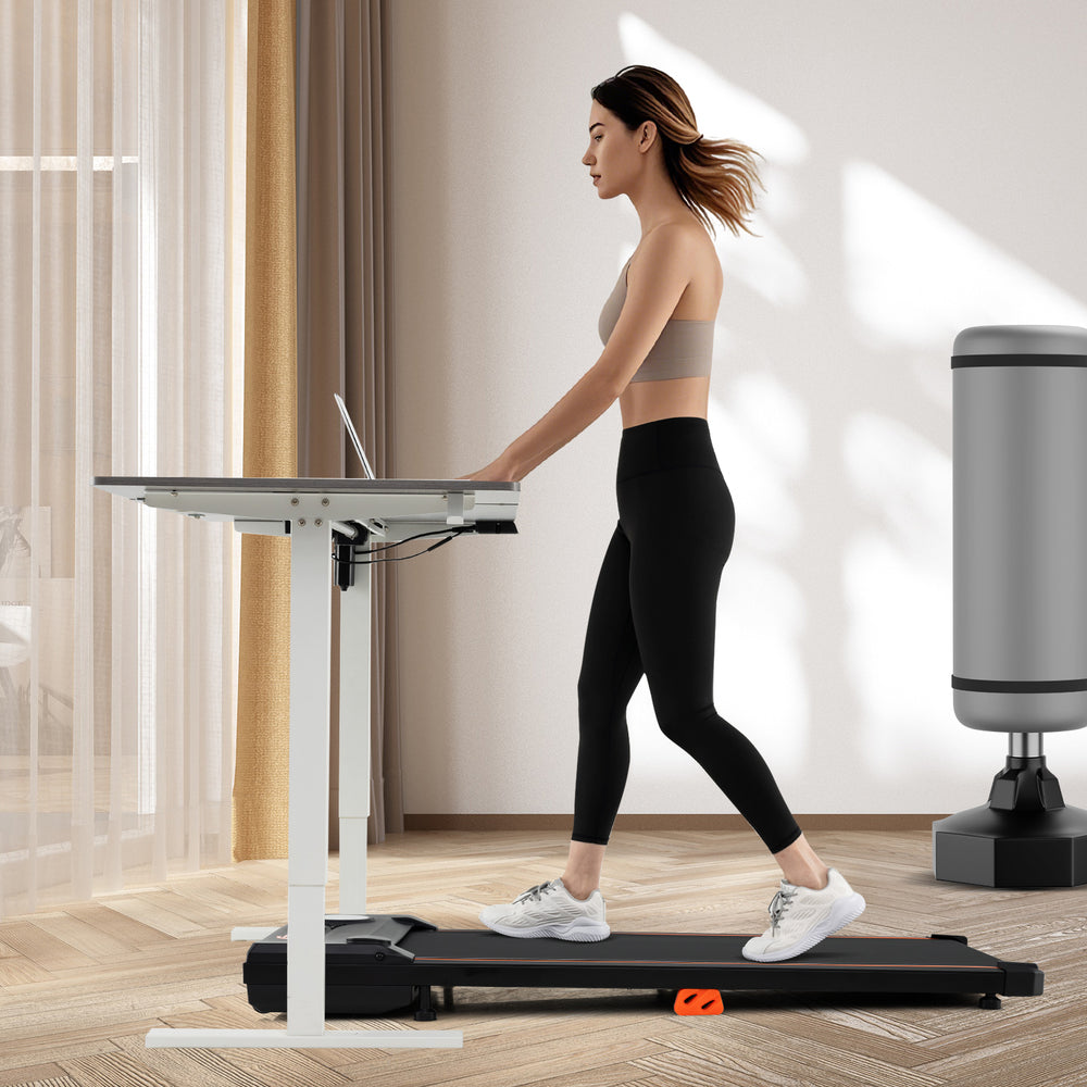 Under desk treadmill in black, featuring a 2.5HP motor and remote control, ideal for home office workouts.