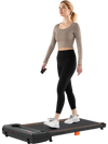 Under desk treadmill in black with remote control, featuring a 2.5HP motor and anti-slip running belt for home office.