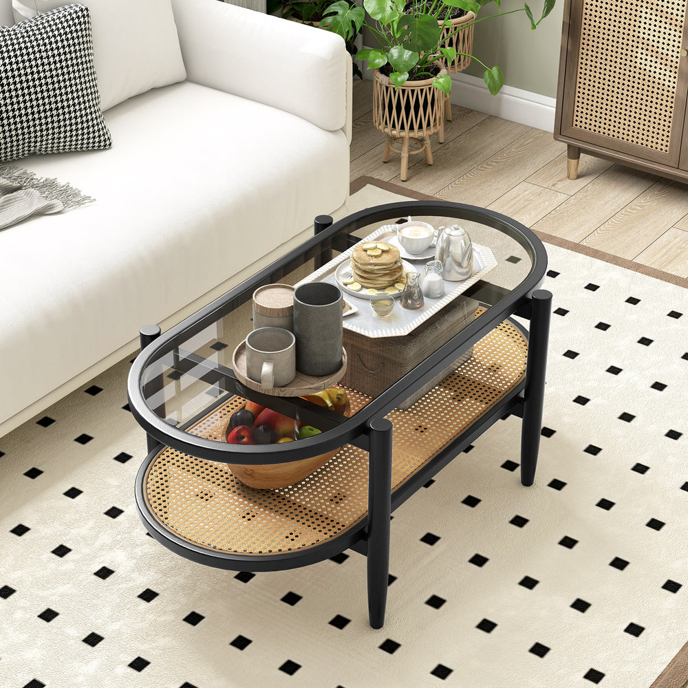 2-tier coffee table with tempered glass top and acacia wood frame, showcasing a stylish arrangement of decorative items.