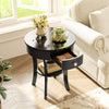 Black round end table with an elegant design, featuring an open shelf and storage drawer, ideal for any interior space.