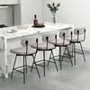 Set of two 25-inch modern beige upholstered bar stools with backrests and footrests, ideal for kitchen islands.